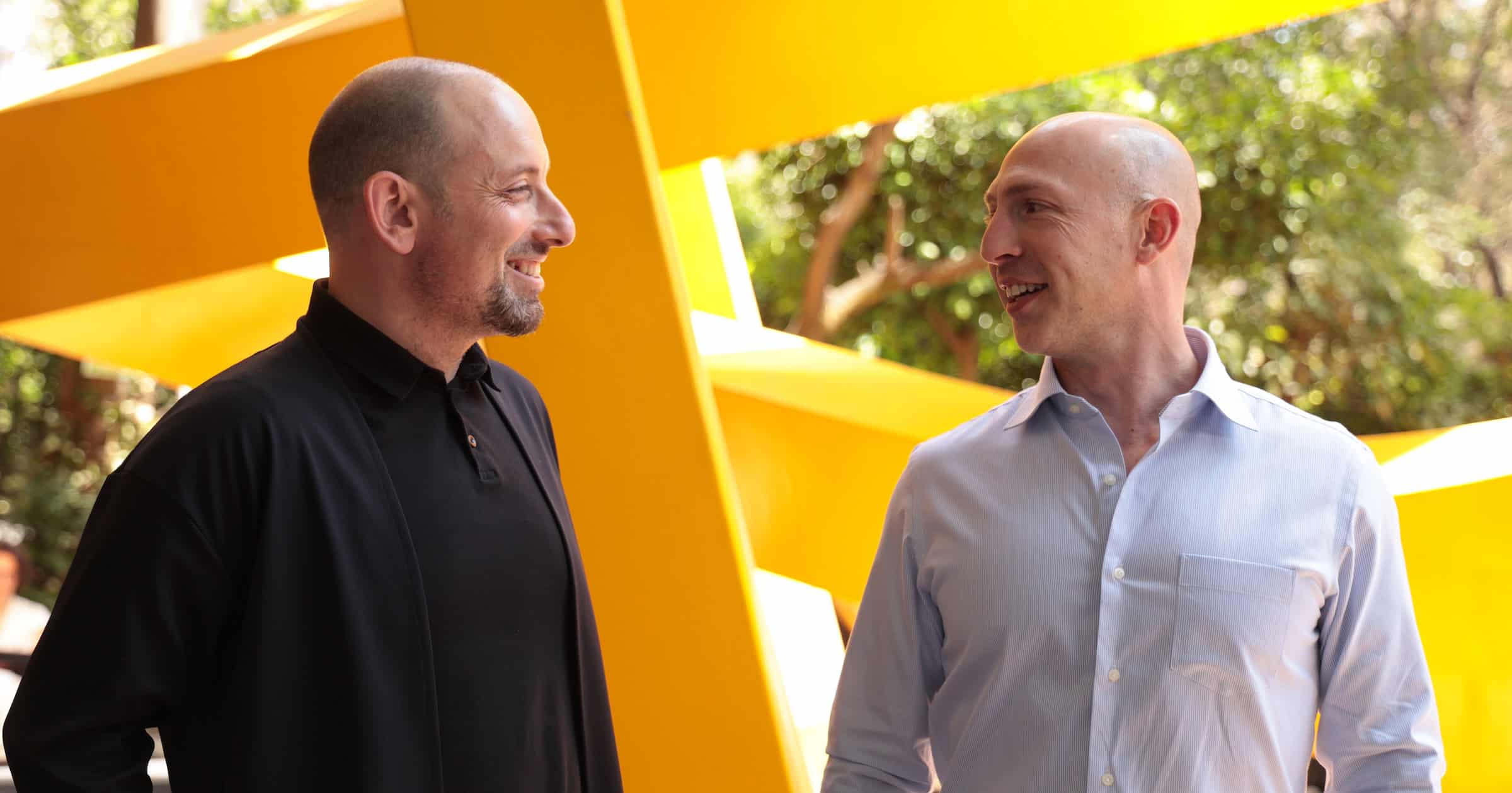 Two consulting business founders discussing success mindset, actions and habits for growth.