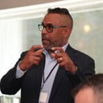 Consultant explaining how to create recurring revenue and sharing a guide to retainers payment