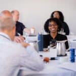 Consultants networking at a mastermind event