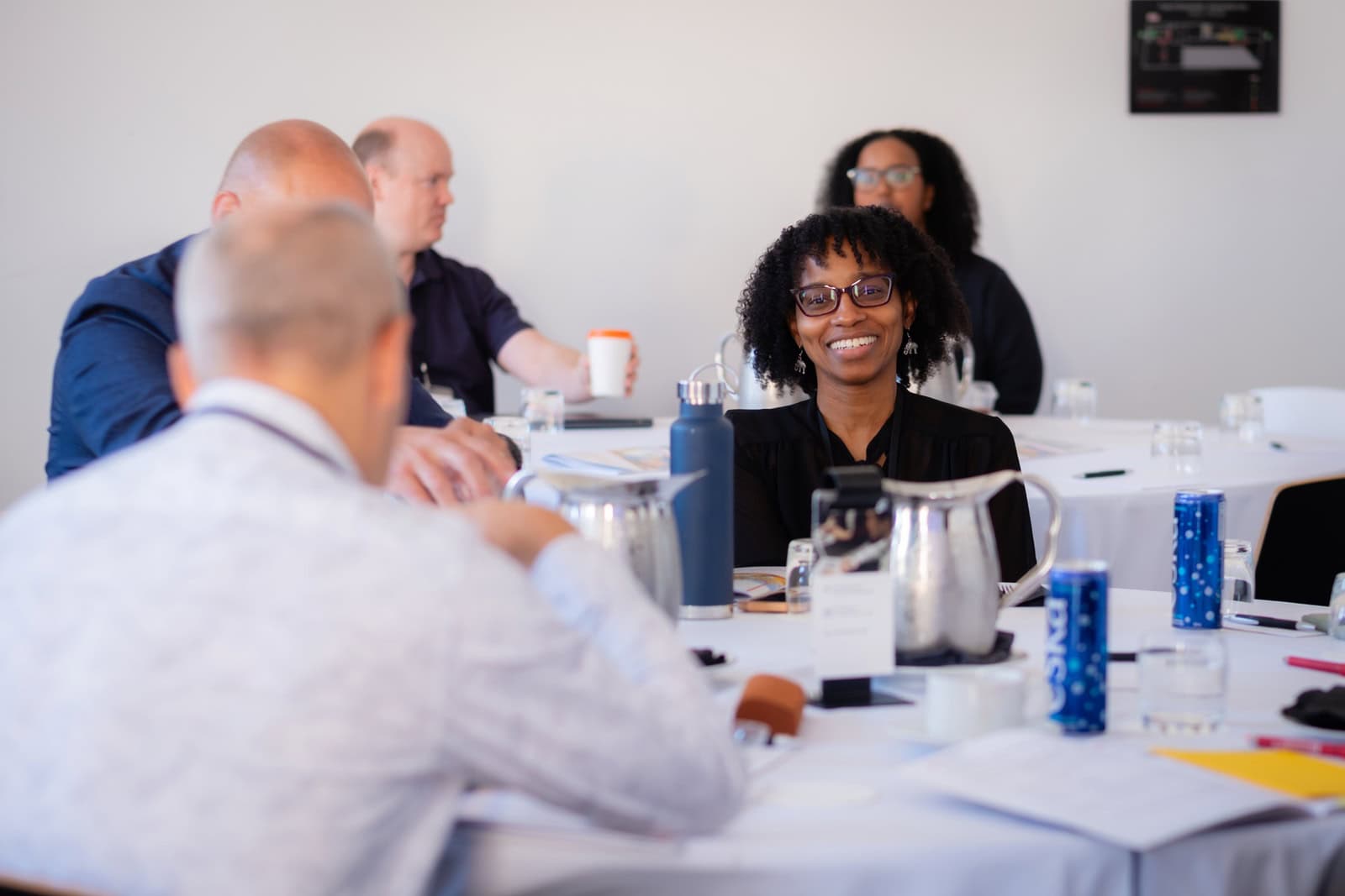 Consultants networking at a mastermind event