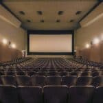 Movie theater screen representing the "Movie Test" exercise — visualizing your consulting business growth journey and future goals before chasing revenue targets