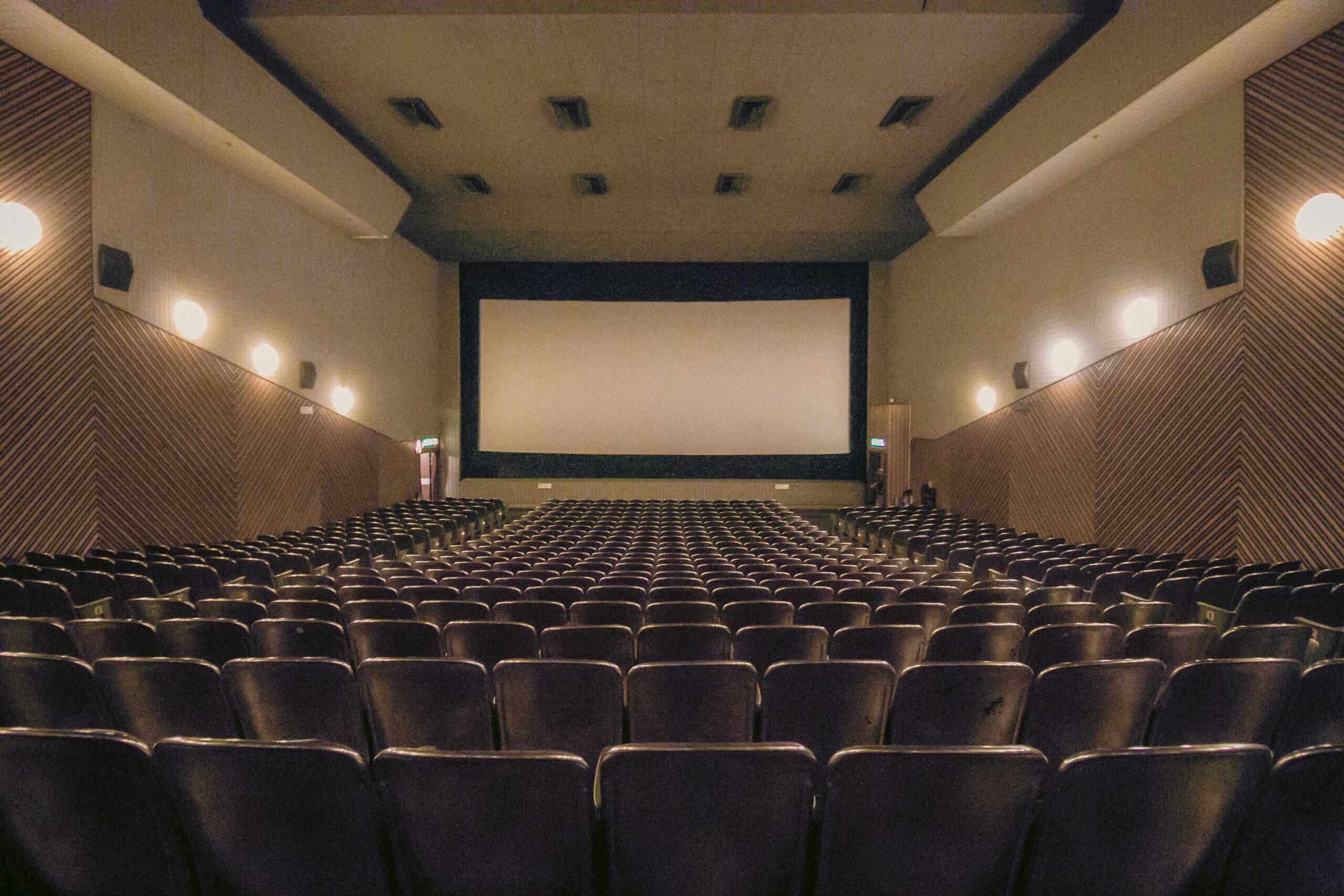 Movie theater screen representing the "Movie Test" exercise — visualizing your consulting business growth journey and future goals before chasing revenue targets